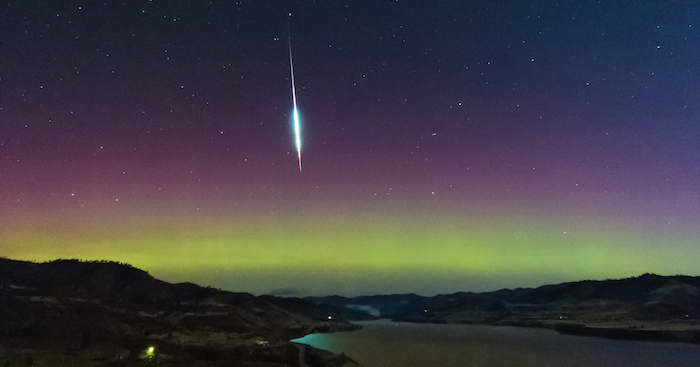 A fireball from the Taurids meteor shower against the Northern Lights near Keller, Washington.
