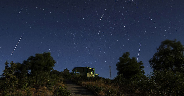 White streaks across a night sky are from the 2013 Geminid Meteor Showers.