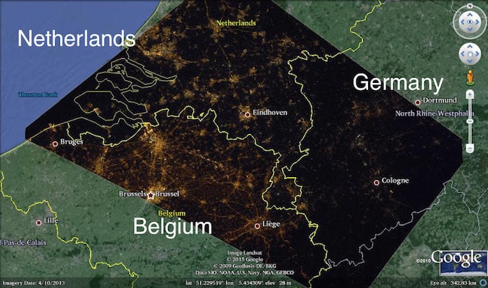 A satellite image showing border of The Netherlands, Belgium, and Germany at night, overlaid on a regional map. Image from an International Astronomical Union press release.