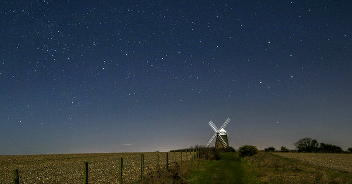 The eighteenth century Halnaker Windmill lit by moonlight. Photo by South Downs National Park Authority.