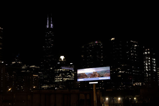 An illuminated billboard contributes to light pollution.